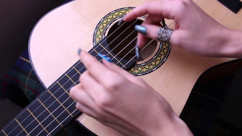 playing guitar with long nail